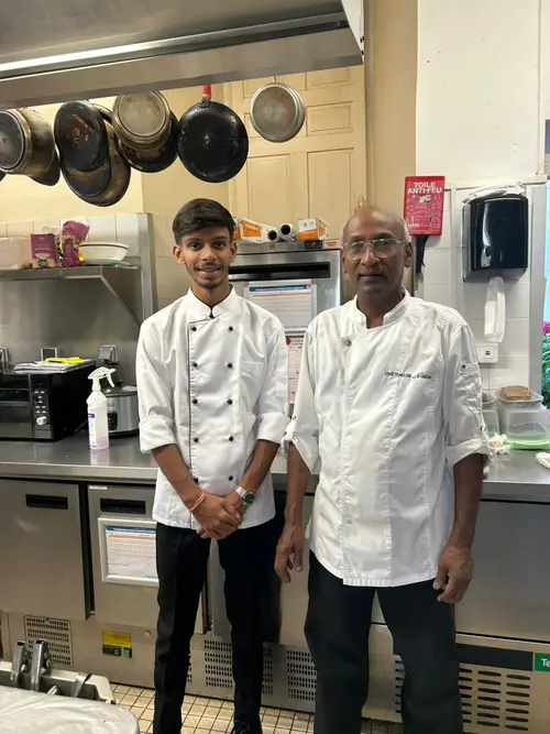 Hospitality Mentor and Student Smiling